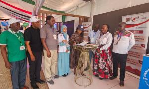 Signing visitors book with PS